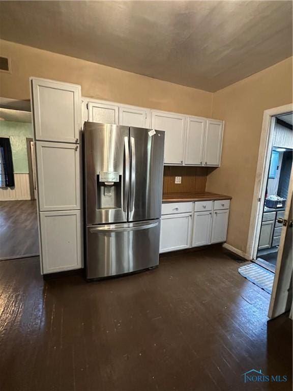 kitchen featuring stainless steel fridge with ice dispenser, white cabinets, and dark hardwood / wood-style floors