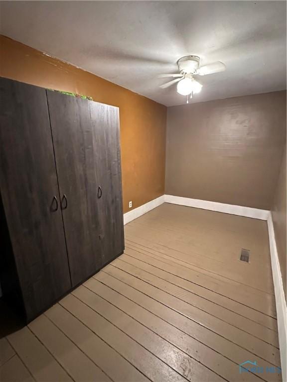 interior space featuring hardwood / wood-style floors and ceiling fan