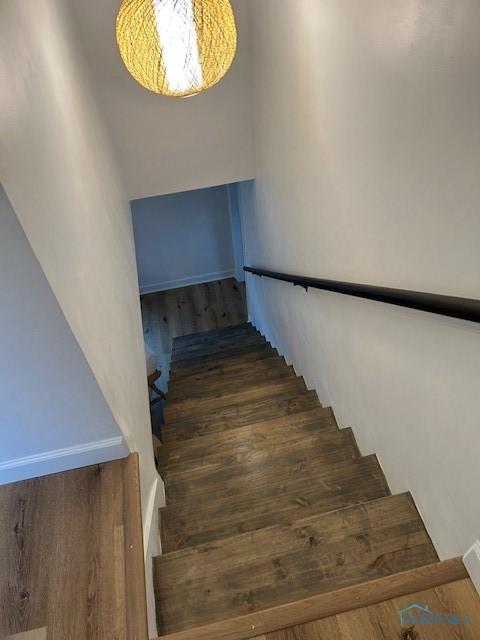 staircase featuring hardwood / wood-style floors