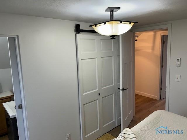 bedroom featuring dark wood-type flooring