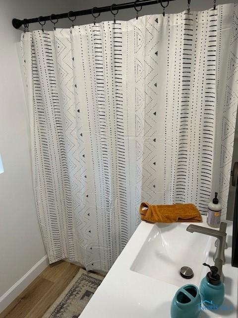 bathroom featuring hardwood / wood-style floors and sink