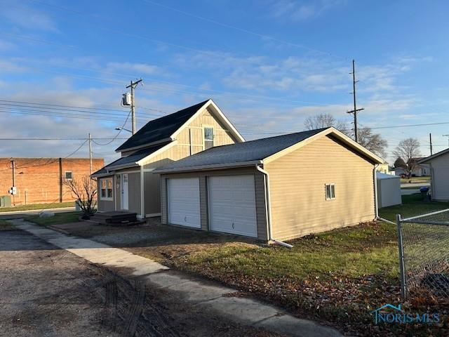 view of side of property featuring a garage