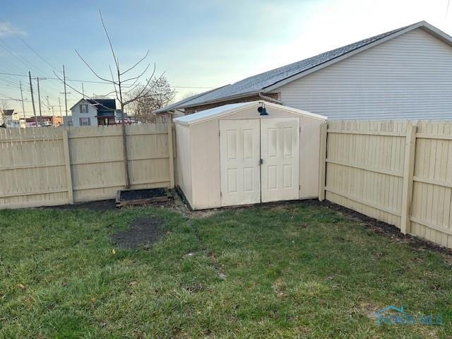 view of outbuilding featuring a lawn