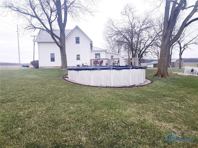 view of yard featuring a covered pool