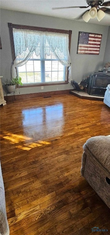 bedroom featuring ceiling fan and dark wood-type flooring