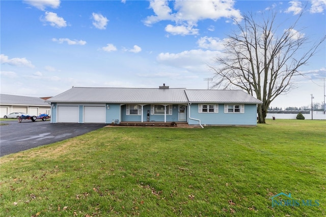 single story home featuring a front yard, a porch, and a garage