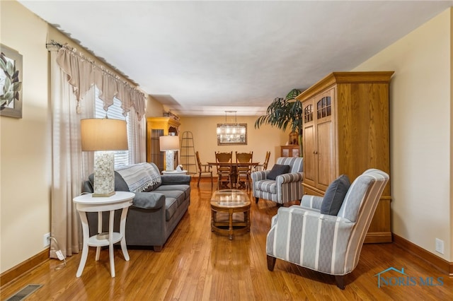 living room with light hardwood / wood-style flooring