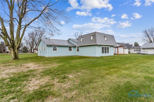 back of house with a yard