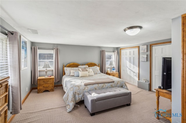 bedroom with light colored carpet