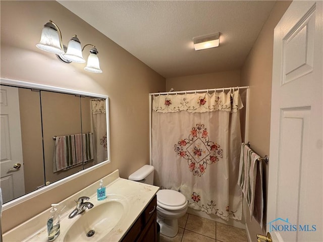 full bathroom featuring vanity, shower / bath combo, tile patterned floors, toilet, and a textured ceiling