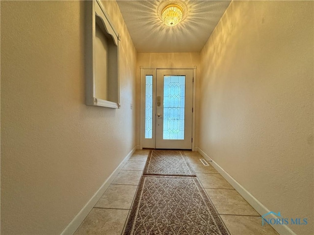 entryway with tile patterned floors