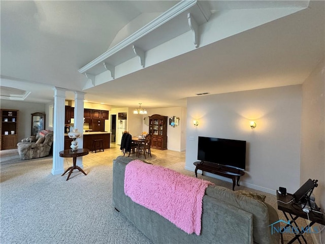 living room featuring light carpet and a chandelier