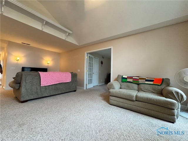 carpeted living room featuring lofted ceiling