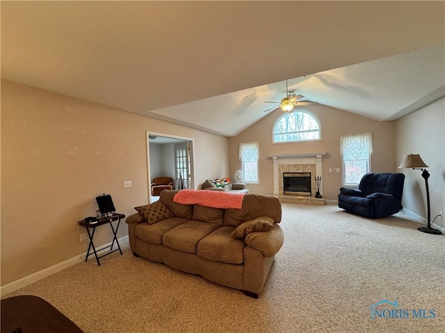 living room featuring carpet floors, vaulted ceiling, and ceiling fan