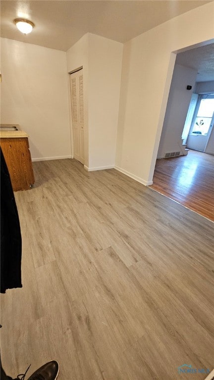 unfurnished room featuring light hardwood / wood-style flooring