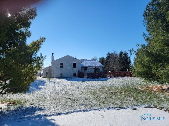 view of snow covered house