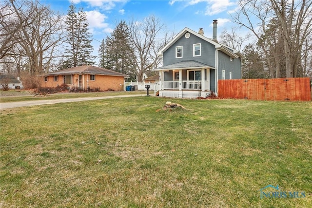 exterior space featuring a porch and a front yard