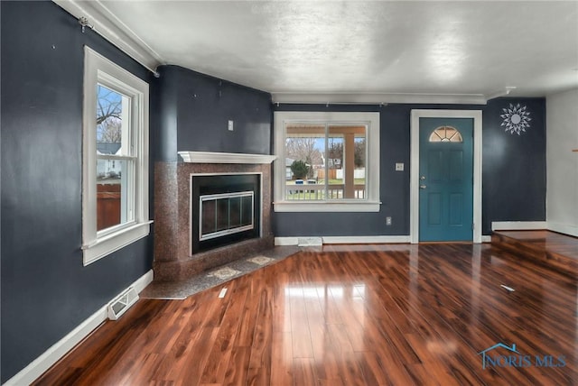 unfurnished living room featuring hardwood / wood-style floors