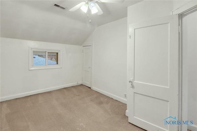 bonus room featuring ceiling fan, light colored carpet, and vaulted ceiling