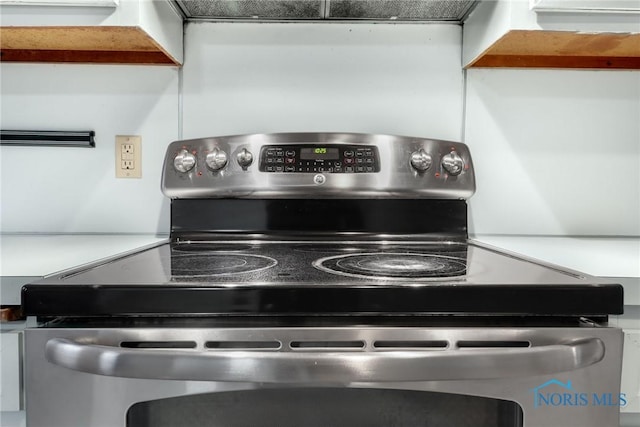 details featuring stainless steel range with electric stovetop