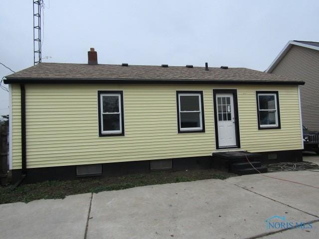 back of house with a patio