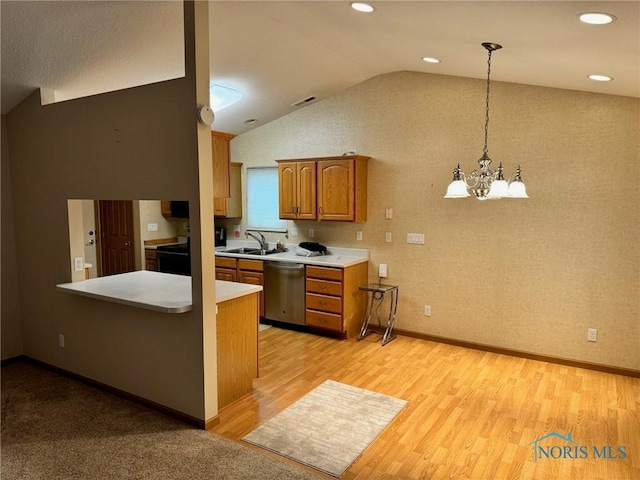 kitchen with pendant lighting, dishwasher, lofted ceiling, an inviting chandelier, and light hardwood / wood-style flooring