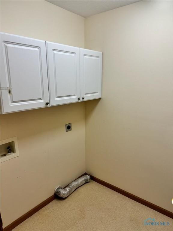 laundry room with electric dryer hookup, cabinets, light carpet, and hookup for a washing machine