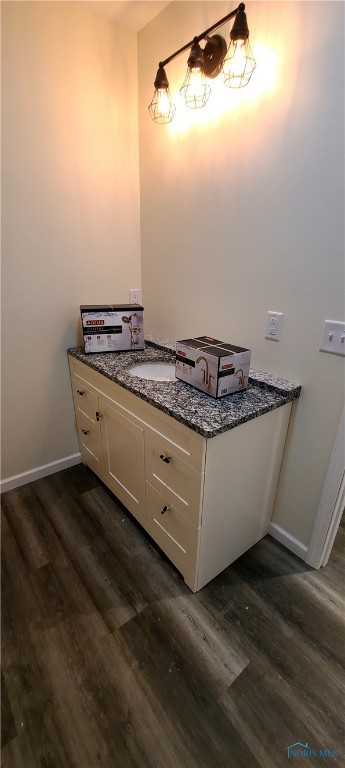 bathroom featuring hardwood / wood-style floors and vanity