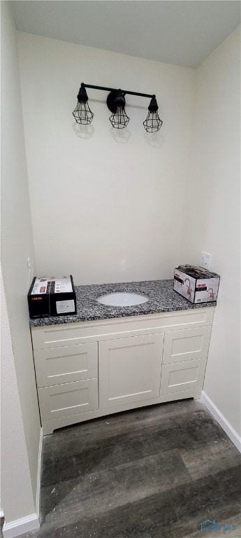 bathroom with sink and wood-type flooring