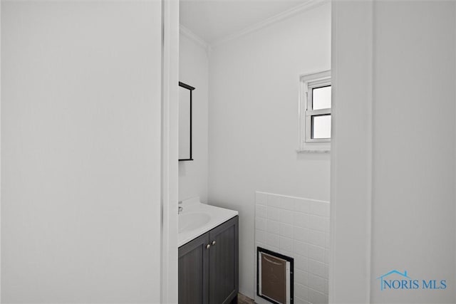 bathroom featuring vanity and crown molding