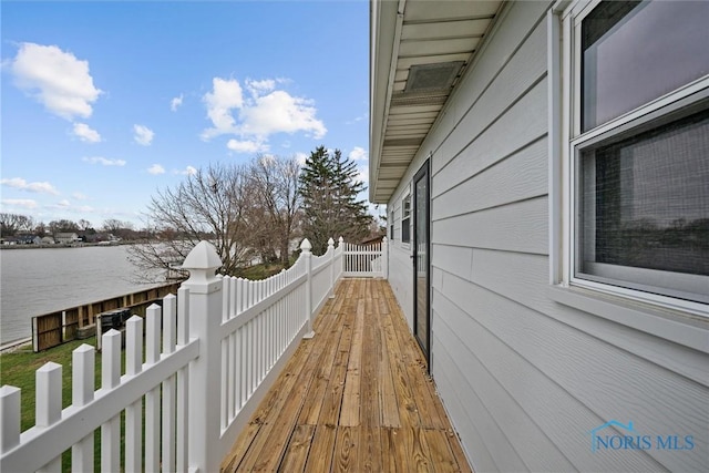 view of side of home with a water view