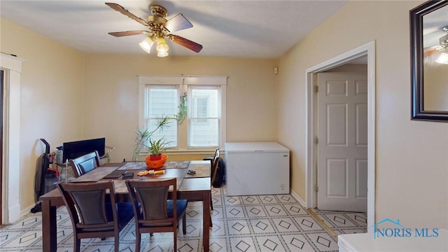 tiled dining room featuring ceiling fan