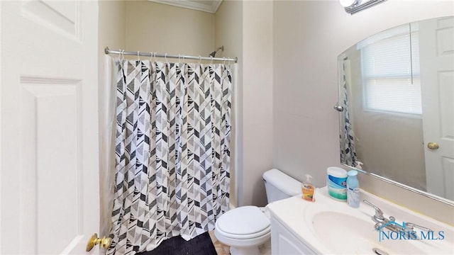 bathroom featuring vanity, toilet, walk in shower, and ornamental molding