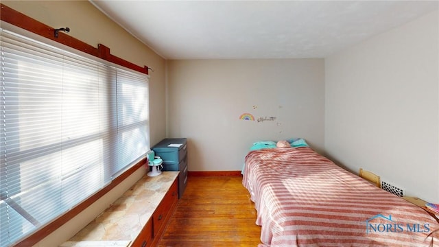 bedroom with light hardwood / wood-style floors