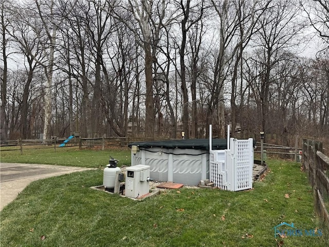 view of yard featuring a covered pool