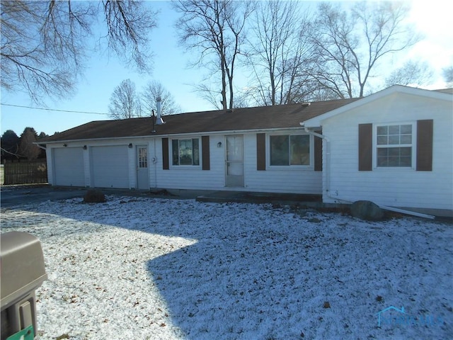 single story home featuring a garage