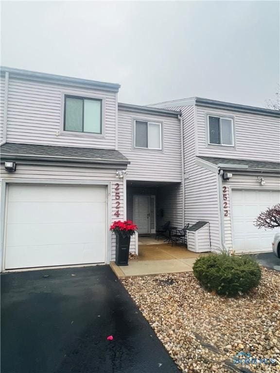 view of front of property with a garage