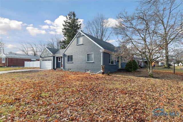 view of side of property featuring a garage