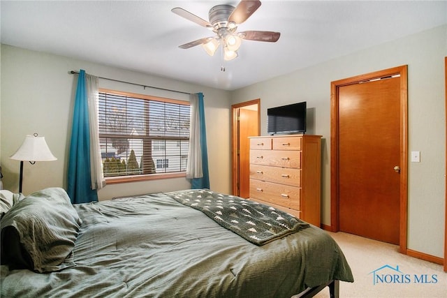 carpeted bedroom featuring ceiling fan