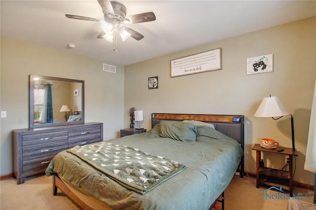 bedroom featuring ceiling fan and light colored carpet