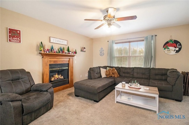 living room with ceiling fan and light colored carpet