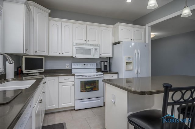 kitchen with white cabinets, white appliances, and sink