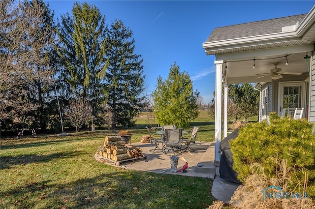 view of yard featuring a patio and ceiling fan