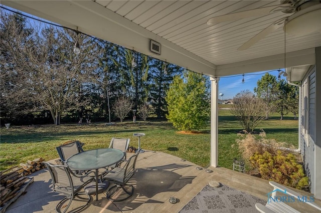 view of patio featuring ceiling fan