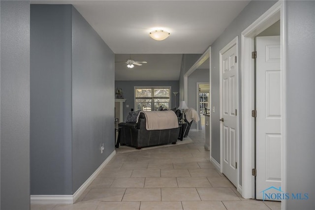 hall featuring light tile patterned flooring