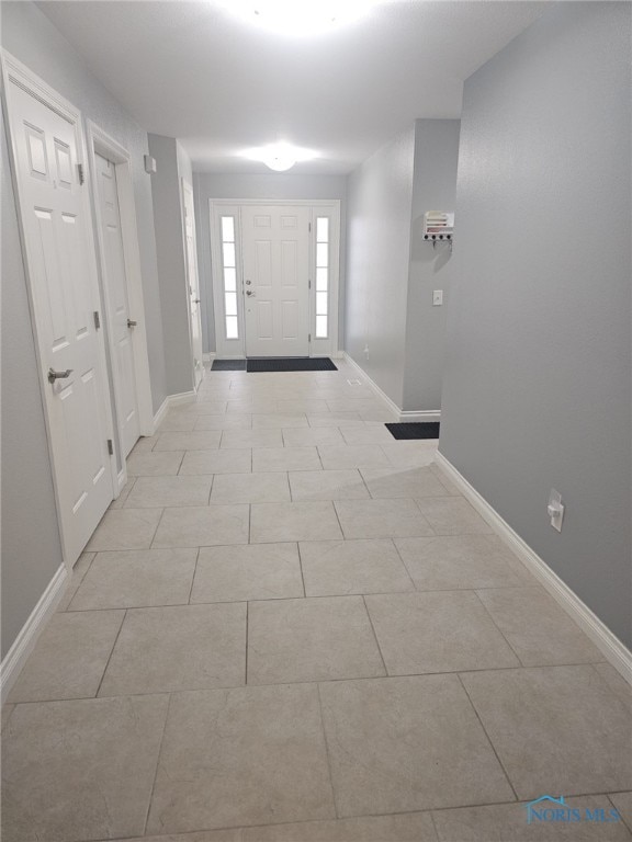 foyer entrance featuring light tile patterned floors