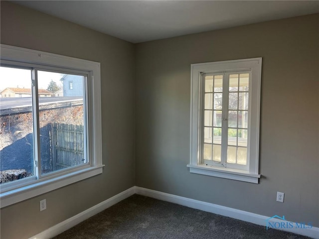 carpeted spare room with french doors