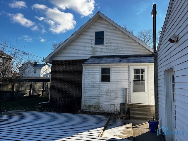 rear view of property with a deck