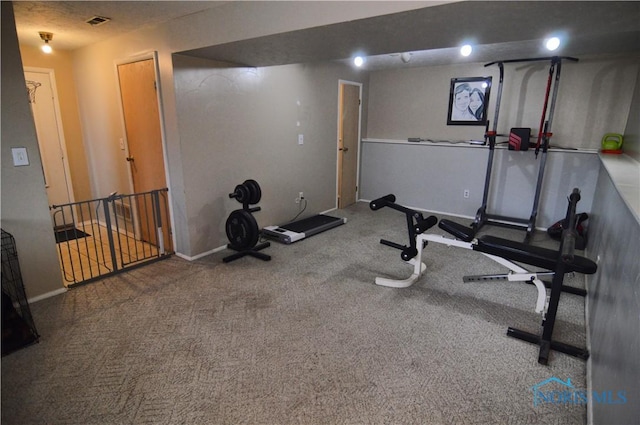 exercise room with carpet flooring