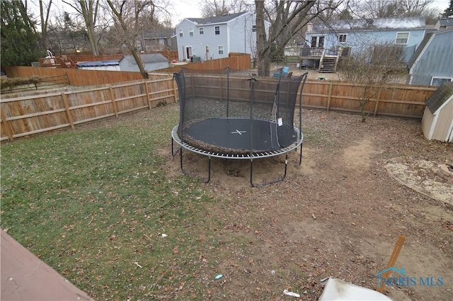 view of yard featuring a trampoline